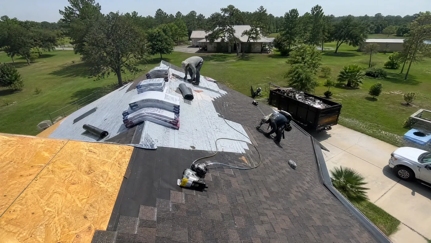 Roofing crew and materials on a roof replacement job in Rosharon Texas