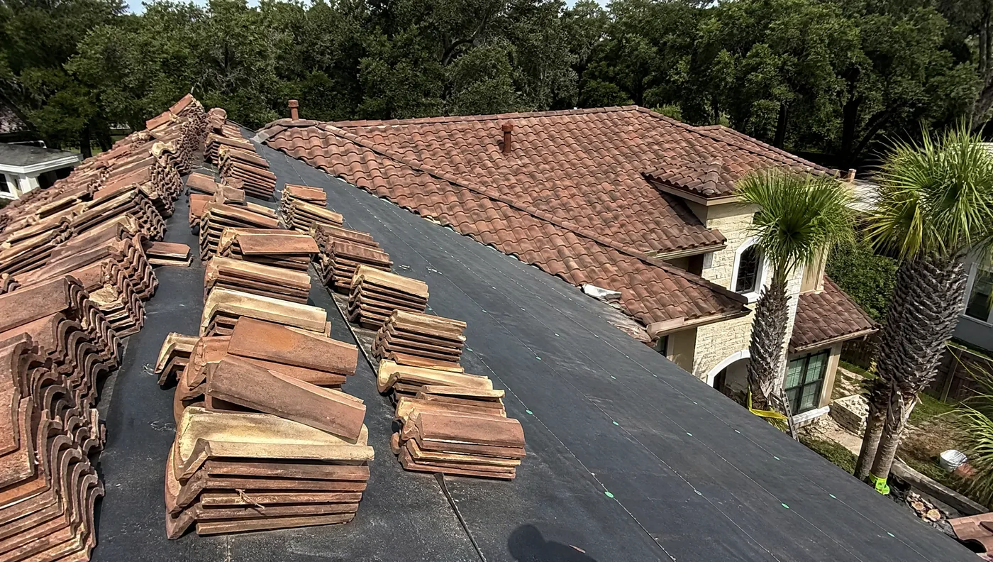 Concrete barrel tile roof repair on a home near Sienna and Missouri City Texas